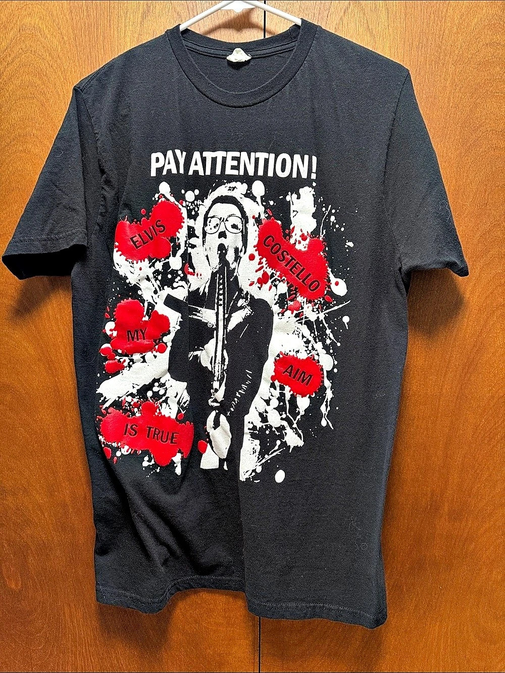 Vintage Elvis Costello Bay Island Graphic Short Sleeve Tee in Black & Red. Size